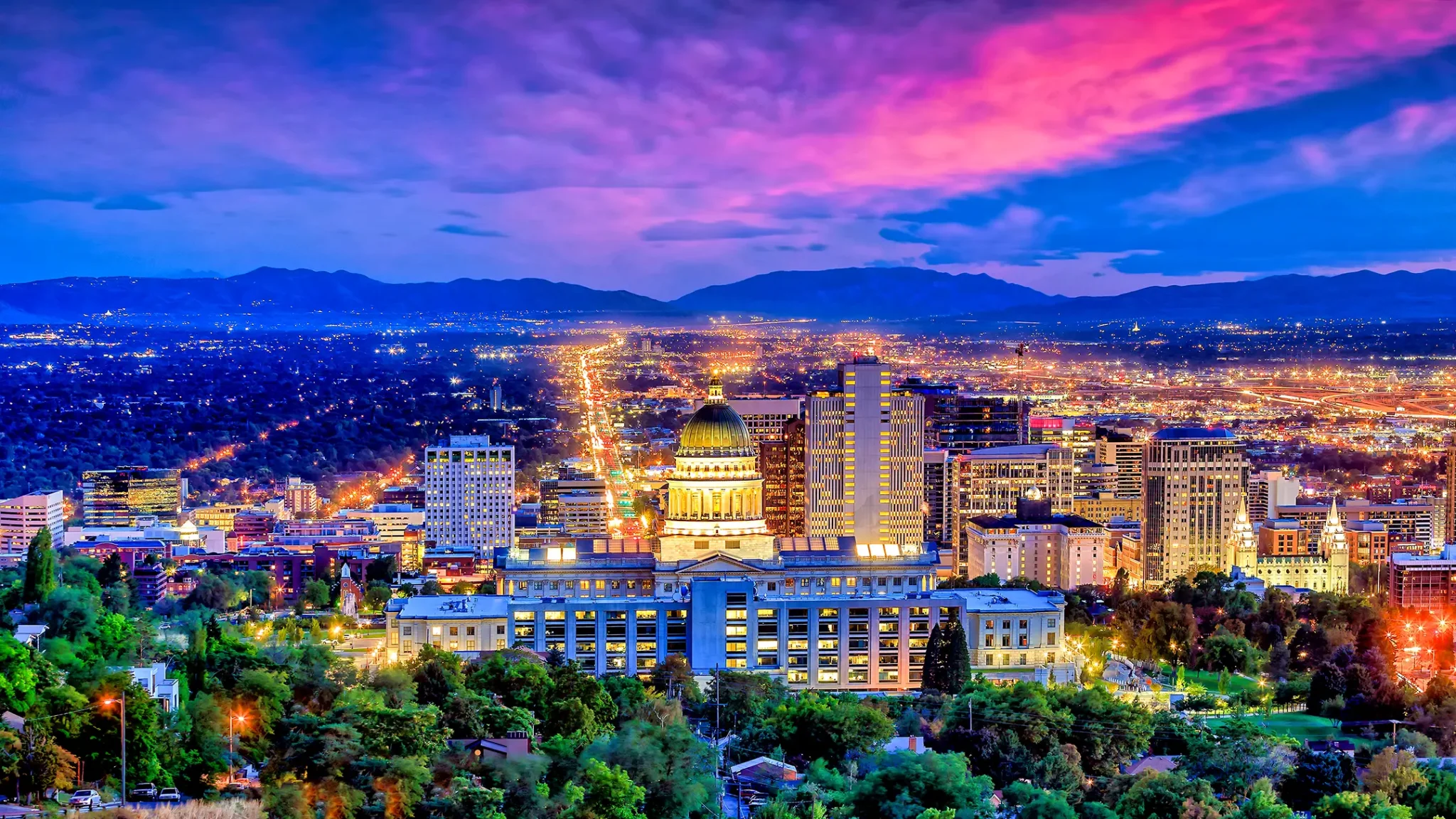 City skyline at dusk with colorful sky.